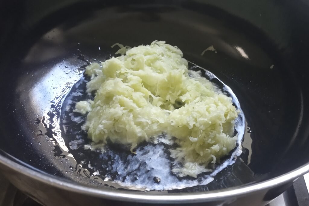 Adding grated lauki