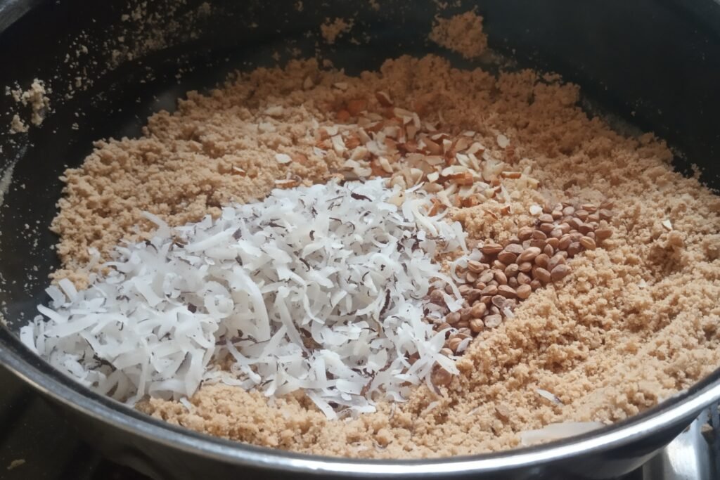 Adding coconut almonds and chironji