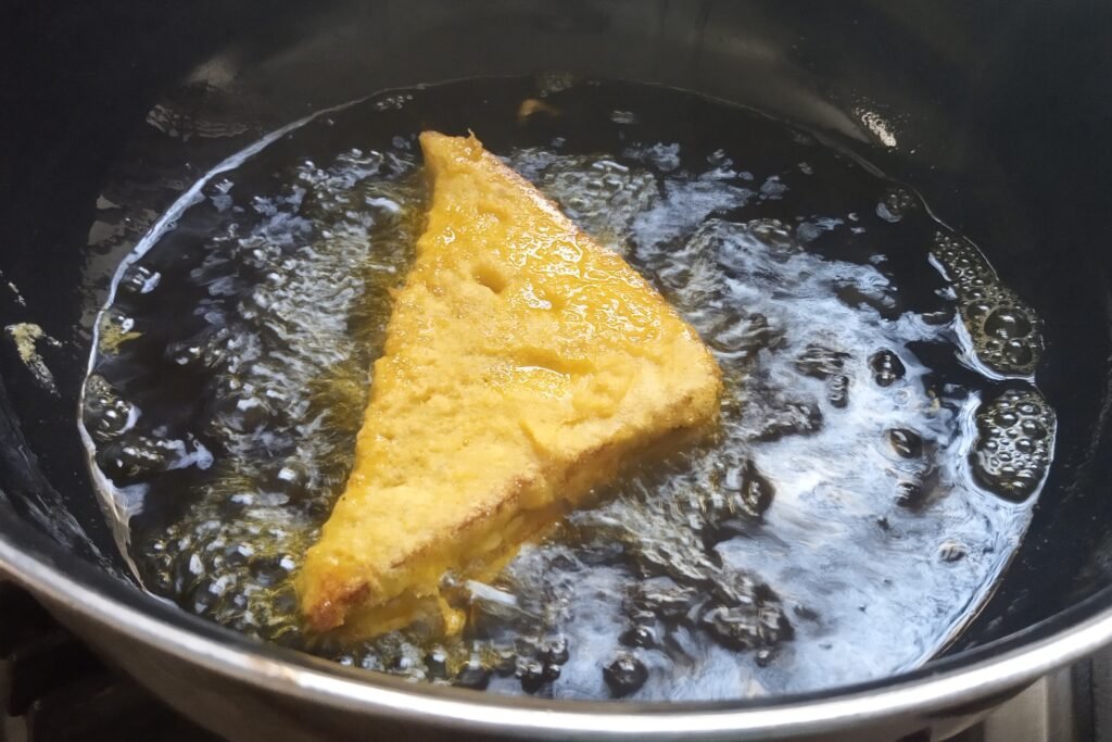 Frying the stuffed bread