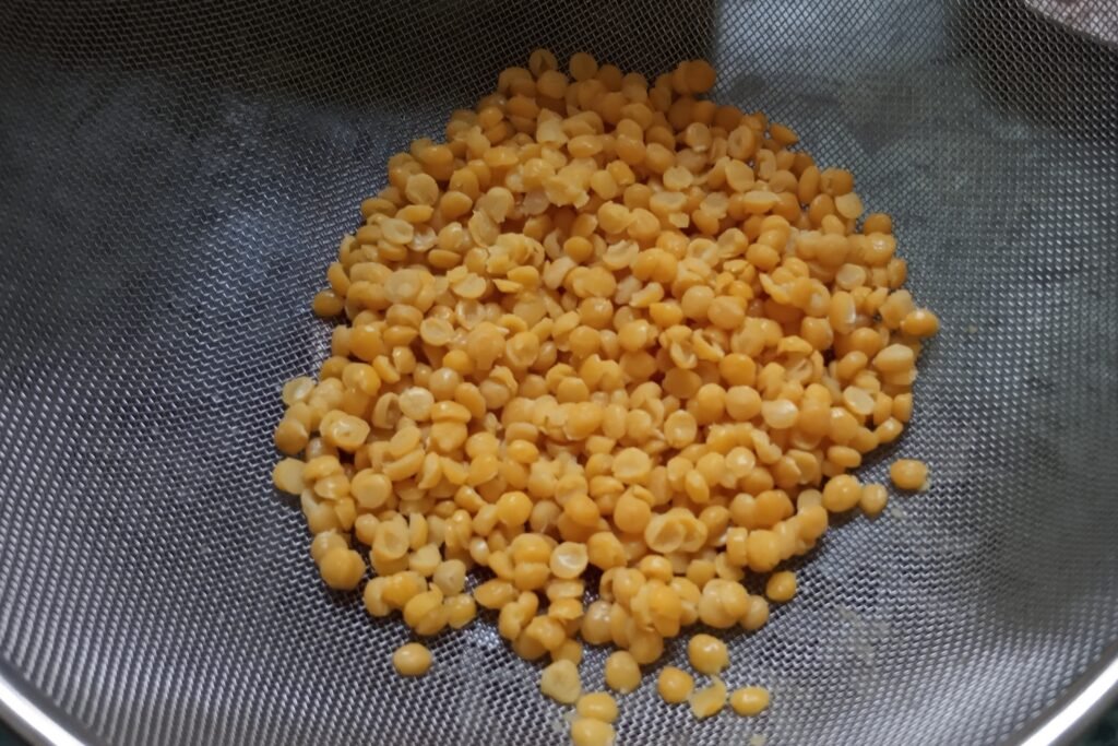 Adding dal to strainer