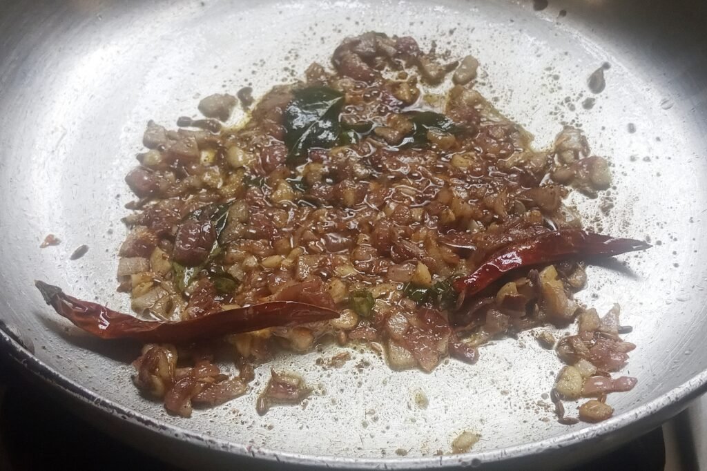 Sauteing spices with onion